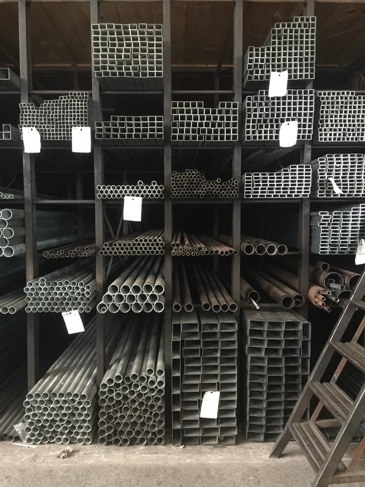 MS pipes and hollow sections organised on warehouse racks