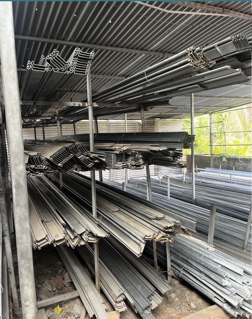 Profiled metal roofing sheets stacked at the yard