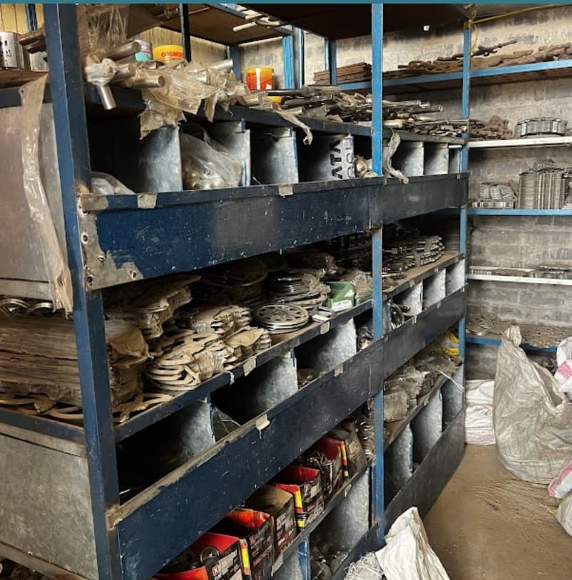 Metal hardware and decorative steel stocked on warehouse shelving