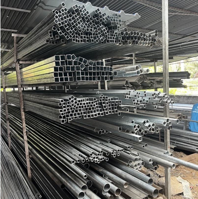 GI and steel pipes stacked on storage racks